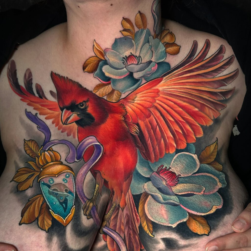 Cardinal tattoo, chest piece, tattoos for all sizes of women, curvy women tattoos, front torso tattoo art for women, evergreen Colorado, Colorado tattoo artist, award winning tattoo artist, melis fusco tattooist 