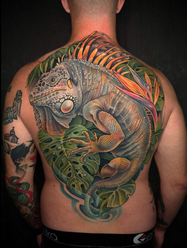 Iguana back piece tattoo, tattoos for men,   tattoo artist in evergreen Colorado, best color tattoo artist Colorado, color tattoo artist Evergreen Colorado, award winning artist Colorado, black sage studio evergreen Colorado, melis fusco tattoo artist 