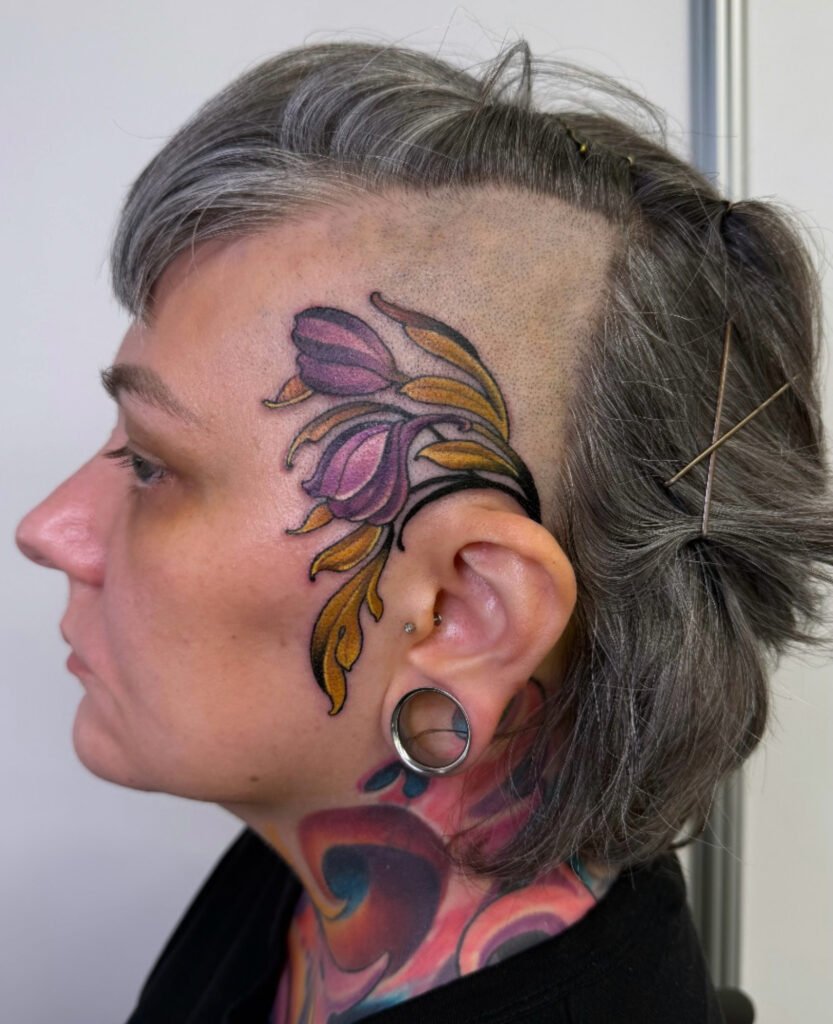 Face tats, tattoos on face, flower tattoos on face, Realistic full color tattoo,  tattoo artist in evergreen Colorado, best color tattoo artist Colorado, color tattoo artist Evergreen Colorado, award winning artist Colorado, black sage studio evergreen Colorado, melis fusco tattoo artist 