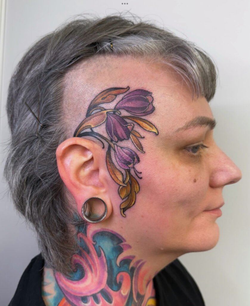 Face tats, tattoos on face, flower tattoos on face, Realistic full color tattoo,  tattoo artist in evergreen Colorado, best color tattoo artist Colorado, color tattoo artist Evergreen Colorado, award winning artist Colorado, black sage studio evergreen Colorado, melis fusco tattoo artist 