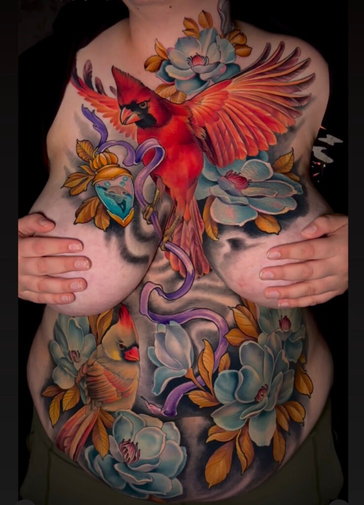 Cardinal tattoo, chest piece, tattoos for all sizes of women, curvy women tattoos, front torso tattoo art for women, evergreen Colorado, Colorado tattoo artist, award winning tattoo artist, melis fusco tattooist 